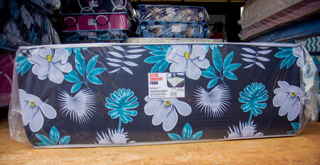 Single hospitality mattress with floral finish on display